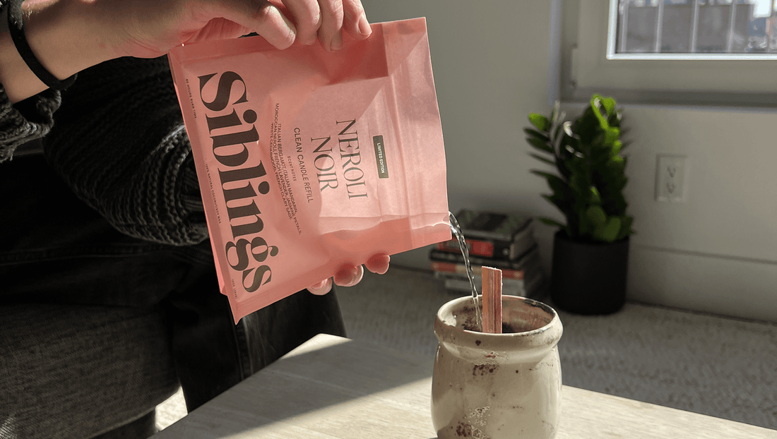 Siblings candle refill kit being poured into a ceramic mug