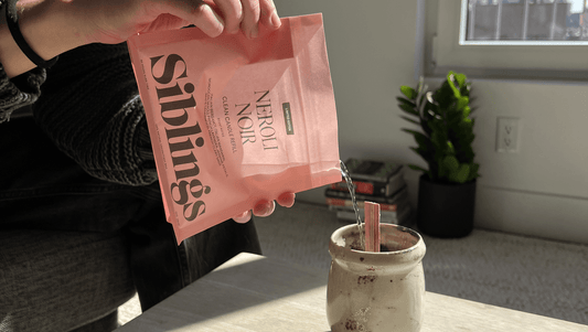 Siblings candle refill kit being poured into a ceramic mug