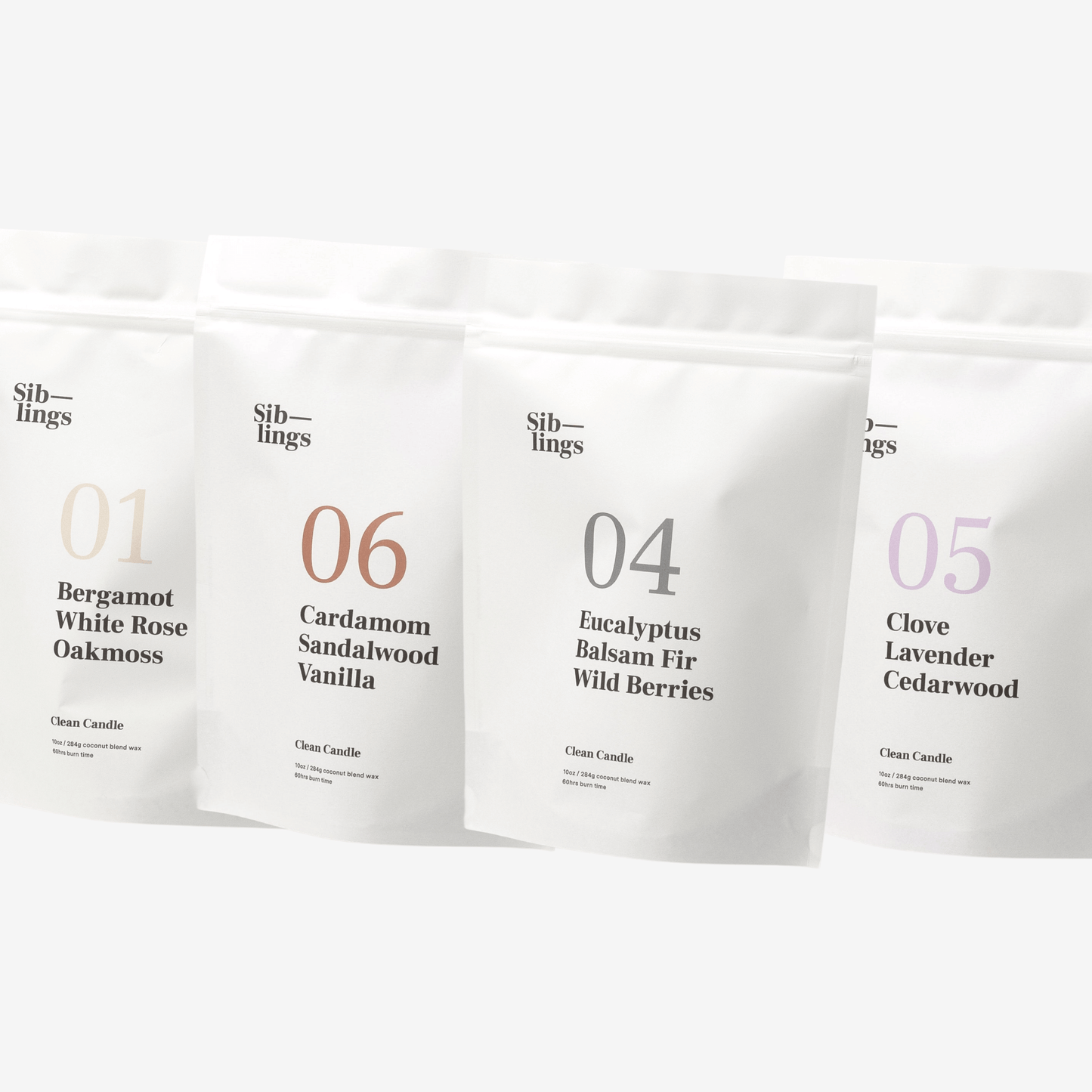 Four white Siblings candle pouches with scent labels on a clean white background, showcasing Bergamot, Eucalyptus, Clove, Cardamom, and Lavender fragrance notes.