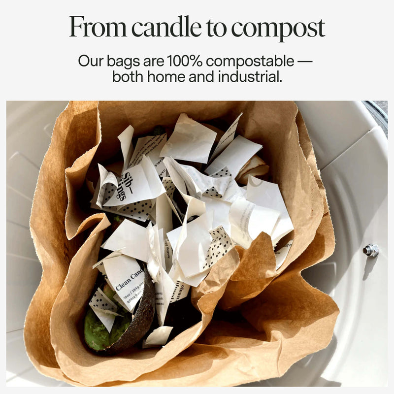 Brown paper bag filled with compostable items including a candle and newspaper, with text about compostability. Our candle bags are 100% compostable, both home and industrial.