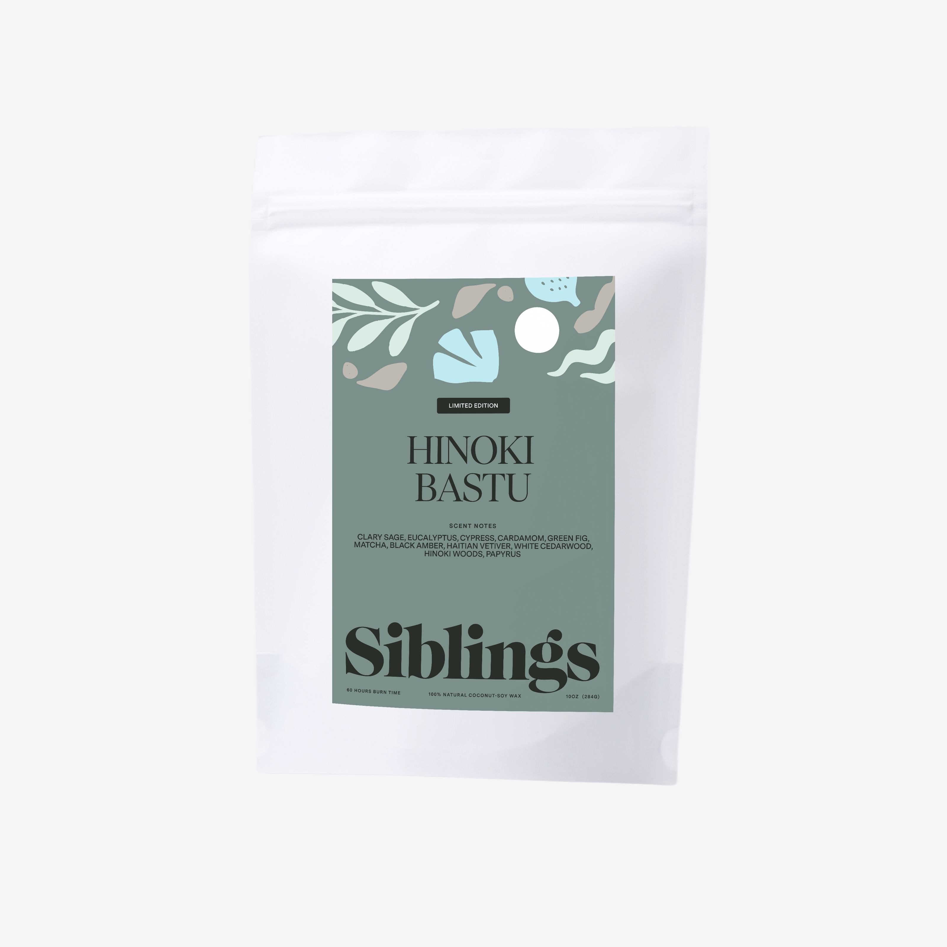 Eco-friendly candle in compostable bag, called 'Hinoki Bastu' with woody and herbal notes