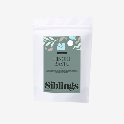 Eco-friendly candle in compostable bag, called 'Hinoki Bastu' with woody and herbal notes