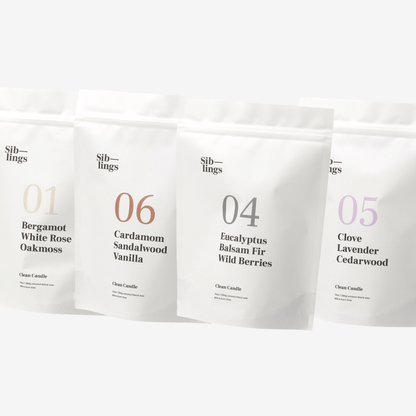 Four white Siblings candle pouches with scent labels on a clean white background, showcasing Bergamot, Eucalyptus, Clove, Cardamom, and Lavender fragrance notes.