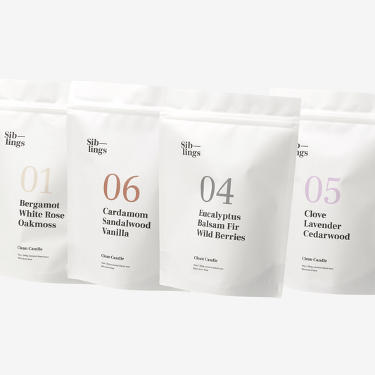 Four white Siblings candle pouches with scent labels on a clean white background, showcasing Bergamot, Eucalyptus, Clove, Cardamom, and Lavender fragrance notes.