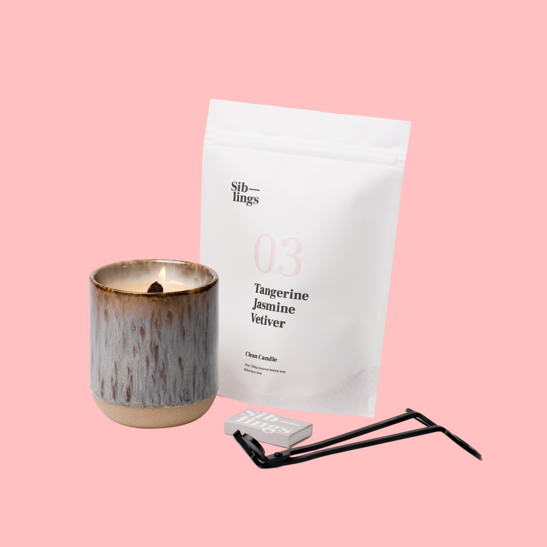 Siblings No. 03 candle starter set with Earth vessel, compostable wax refill bag (Tangerine, Jasmine, Vetiver ), and black wick trimmer, showcasing an eco-friendly refill kit.