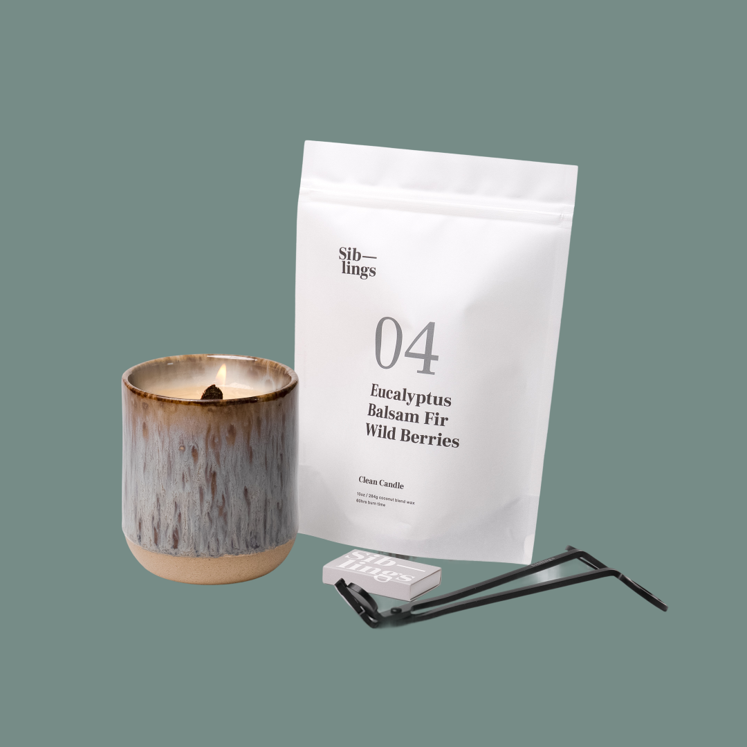 Siblings No. 04 candle starter set with Earth vessel, compostable wax refill bag (Eucalyptus, Balsam, Wild Berries ), and black wick trimmer, showcasing an eco-friendly refill kit.