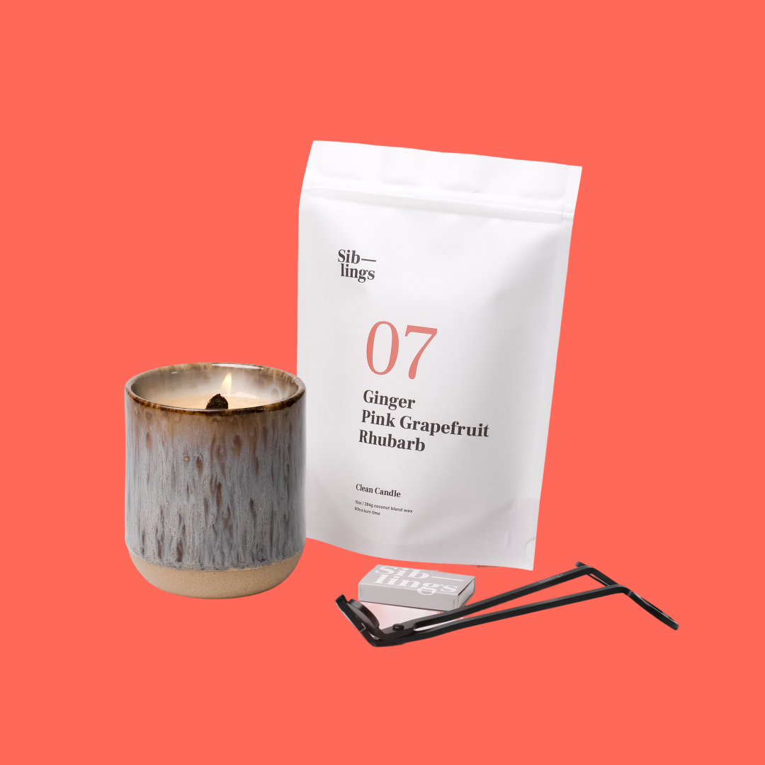 Siblings No. 07 candle starter set with Earth vessel, compostable wax refill bag (Ginger, Pink Grapefruit, Rhubarb ), and black wick trimmer, showcasing an eco-friendly refill kit.