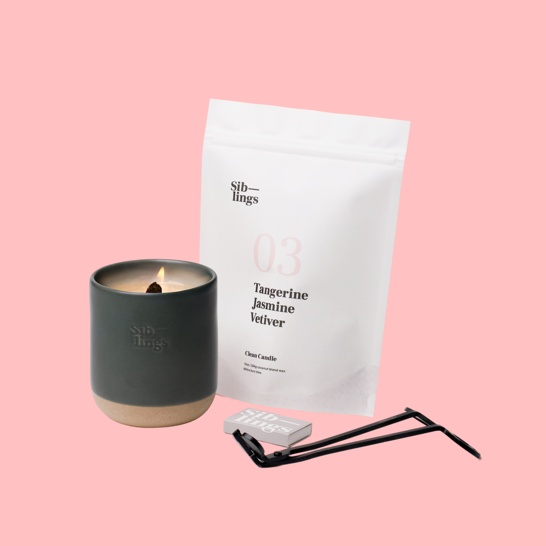 Siblings No. 03 candle starter set with Evergreen vessel, compostable wax refill bag (Tangerine/Jasmine/Vetiver ), and black wick trimmer, showcasing an eco-friendly refill kit.