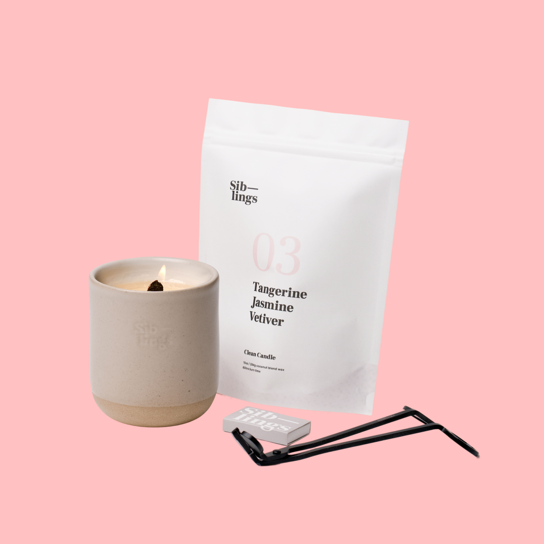 Siblings No. 03 candle starter set with Sand vessel, compostable wax refill bag (Tangerine, Jasmine, Vetiver ), and black wick trimmer, showcasing an eco-friendly refill kit.