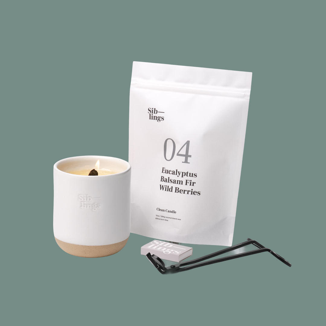 Siblings No. 04 candle starter set with White Cloud vessel, compostable wax refill bag (Eucalyptus, Balsam, Wild Berries), and black wick trimmer, showcasing an eco-friendly refill kit.
