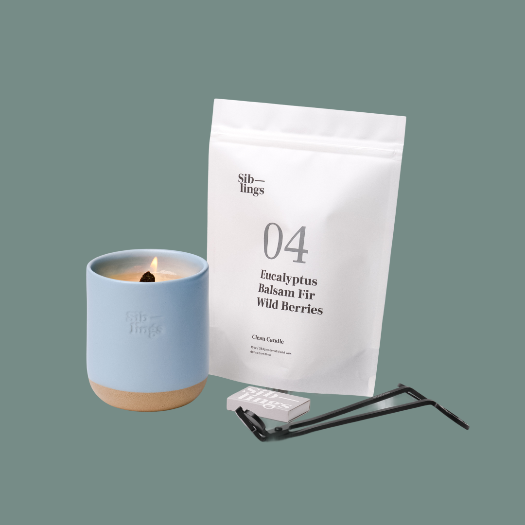 Siblings No. 04 candle starter set with Sky vessel, compostable wax refill bag (Eucalyptus, Balsam, Wild Berries ), and black wick trimmer, showcasing an eco-friendly refill kit.