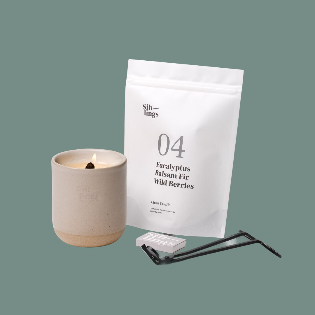 Siblings No. 04 candle starter set with Sand vessel, compostable wax refill bag (Eucalyptus, Balsam, Wild Berries ), and black wick trimmer, showcasing an eco-friendly refill kit.