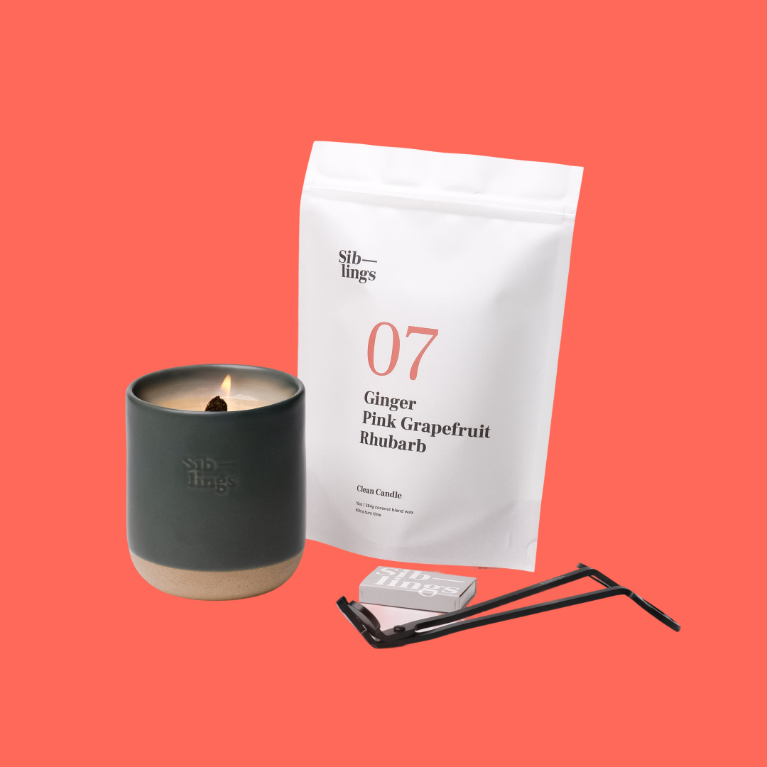 Siblings No. 07 candle starter set with Evergreen vessel, compostable wax refill bag (Ginger, Pink Grapefruit, Rhubarb ), and black wick trimmer, showcasing an eco-friendly refill kit.