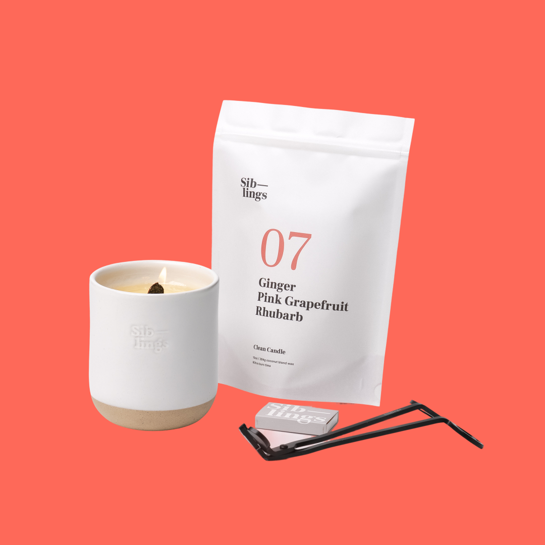 Siblings No. 07 candle starter set with White Cloud vessel, compostable wax refill bag (Ginger, Pink Grapefruit, Rhubarb ), and black wick trimmer, showcasing an eco-friendly refill kit.
