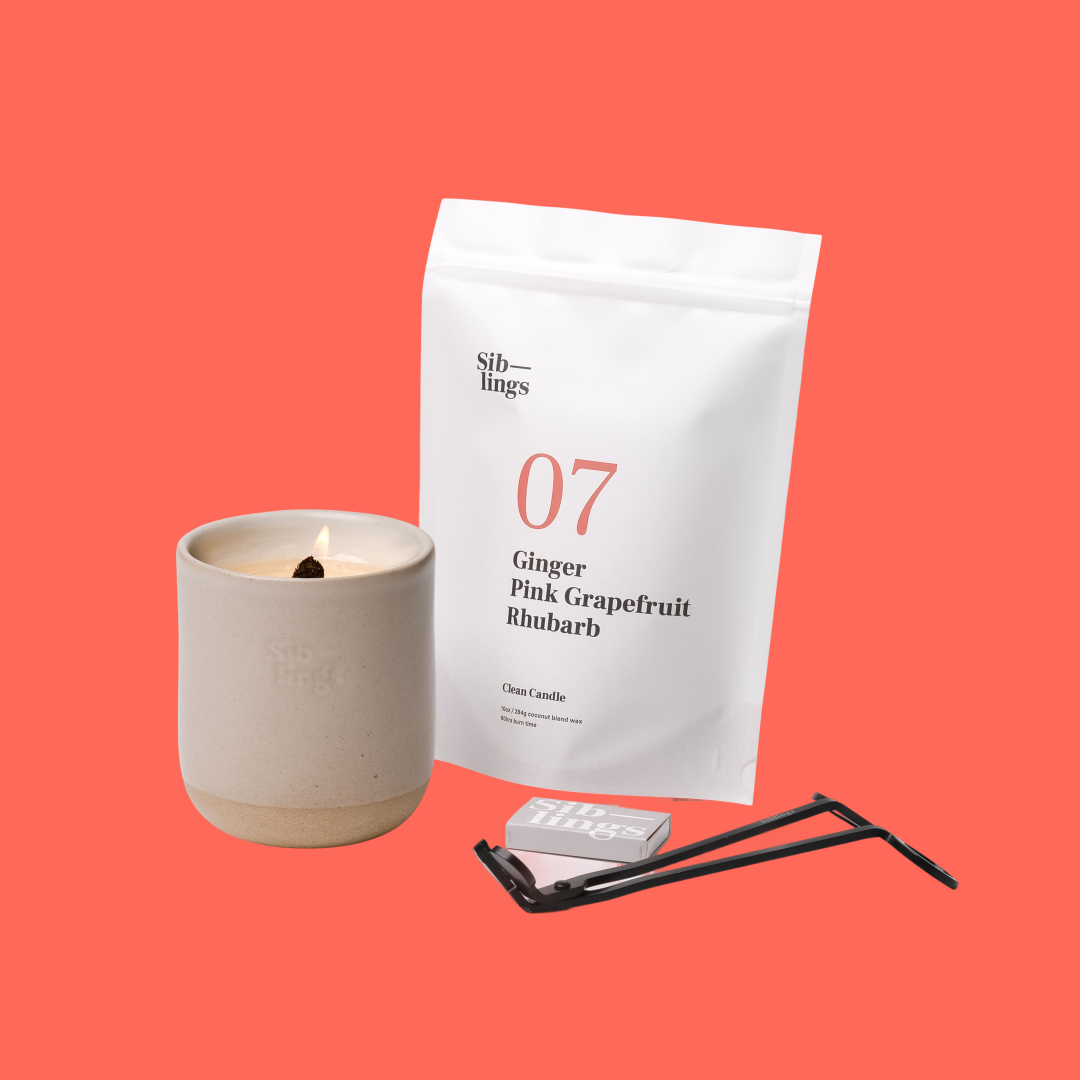 Siblings No. 07 candle starter set with Sand vessel, compostable wax refill bag (Ginger, Pink Grapefruit, Rhubarb ), and black wick trimmer, showcasing an eco-friendly refill kit.