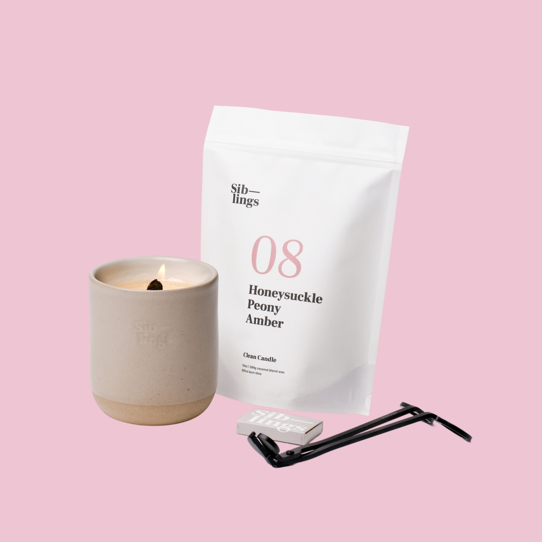 Siblings No. 08 candle starter set with Sand vessel, compostable wax refill bag (Peony, Honeysuckle, Amber ), and black wick trimmer, showcasing an eco-friendly refill kit.