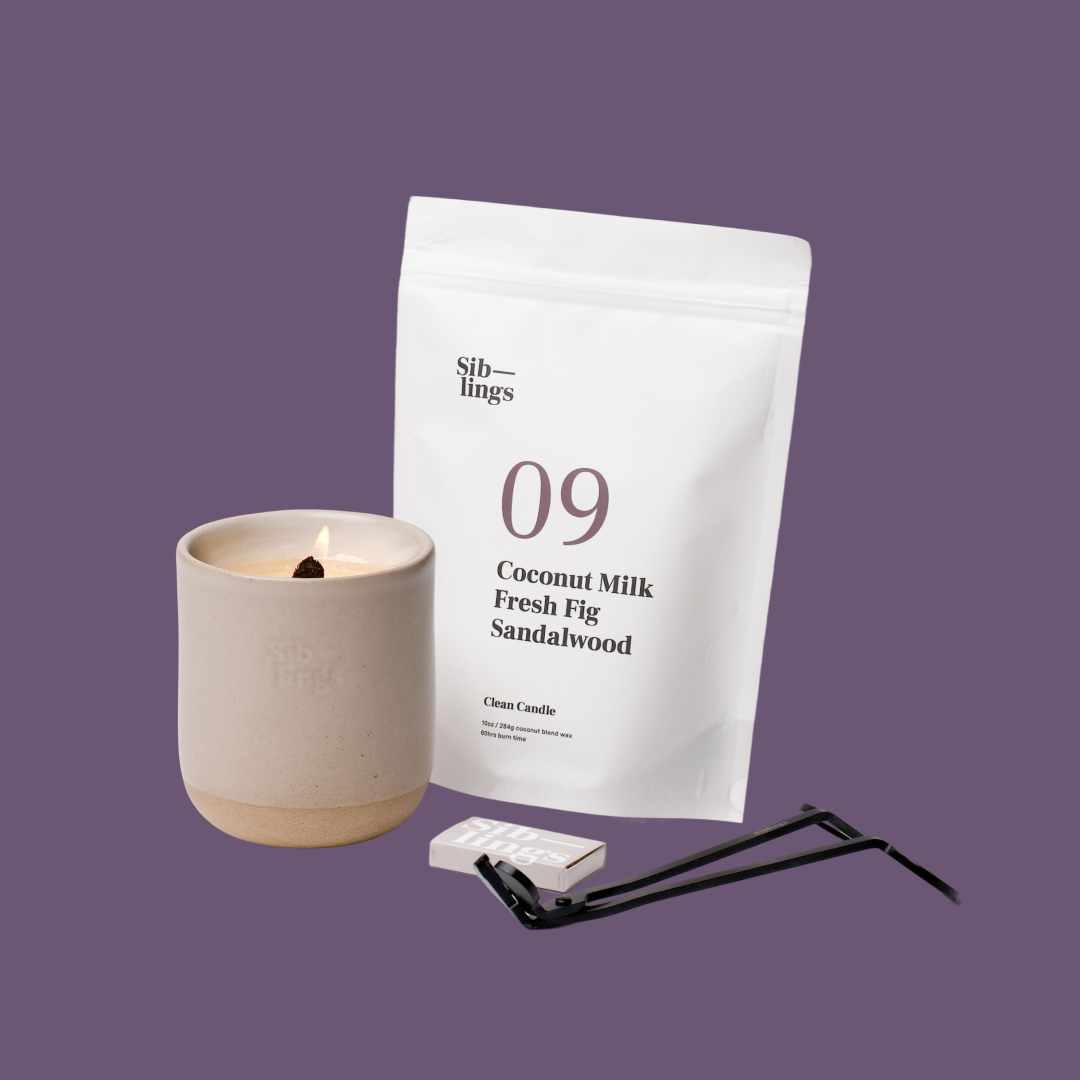 Siblings No. 09 candle starter set with Sand vessel, compostable wax refill bag (Coconut Milk, Fig, Sandalwood ), and black wick trimmer, showcasing an eco-friendly refill kit.