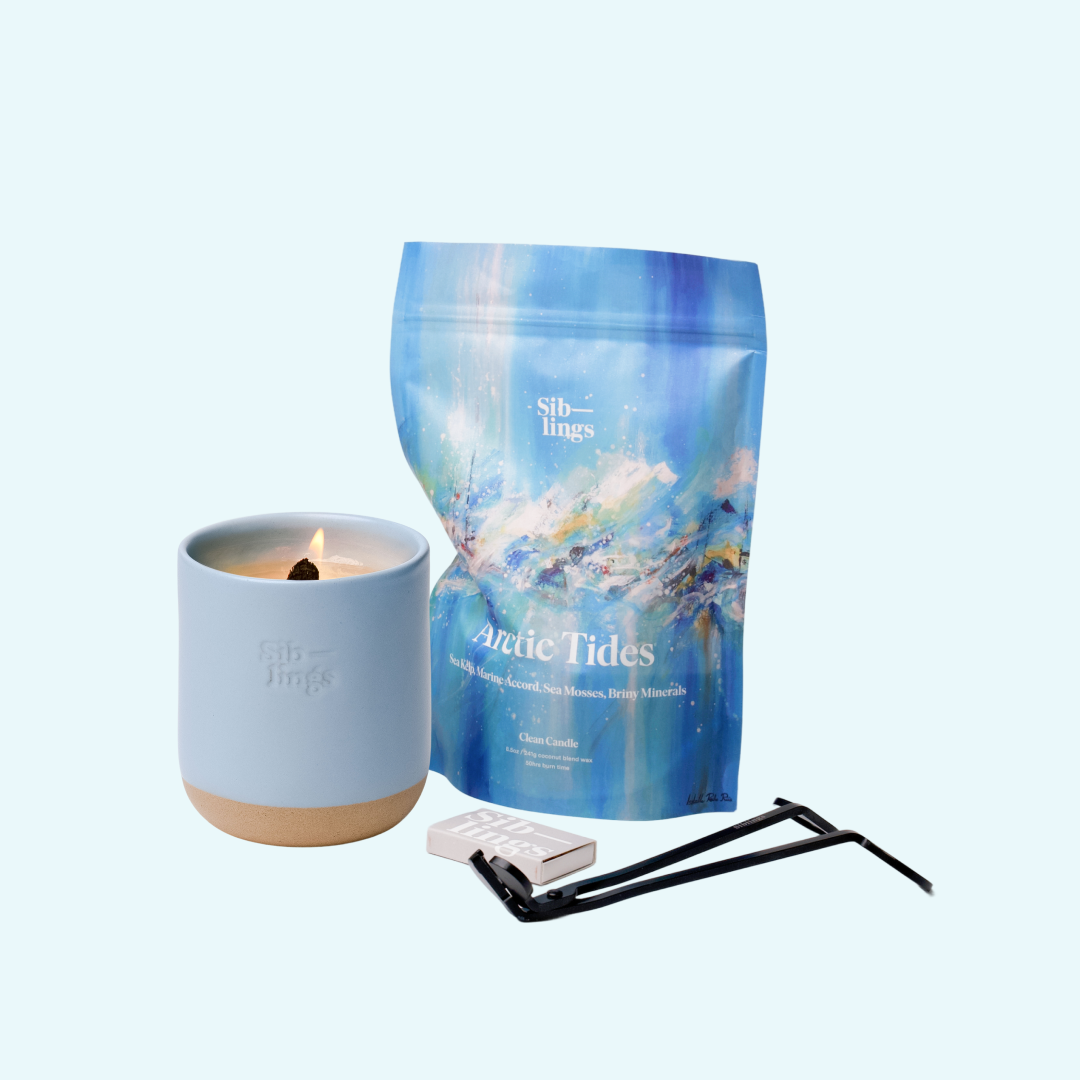Siblings Arctic Tides candle starter set with Sky vessel, compostable wax refill bag, and black wick trimmer, showcasing an eco-friendly refill kit.
