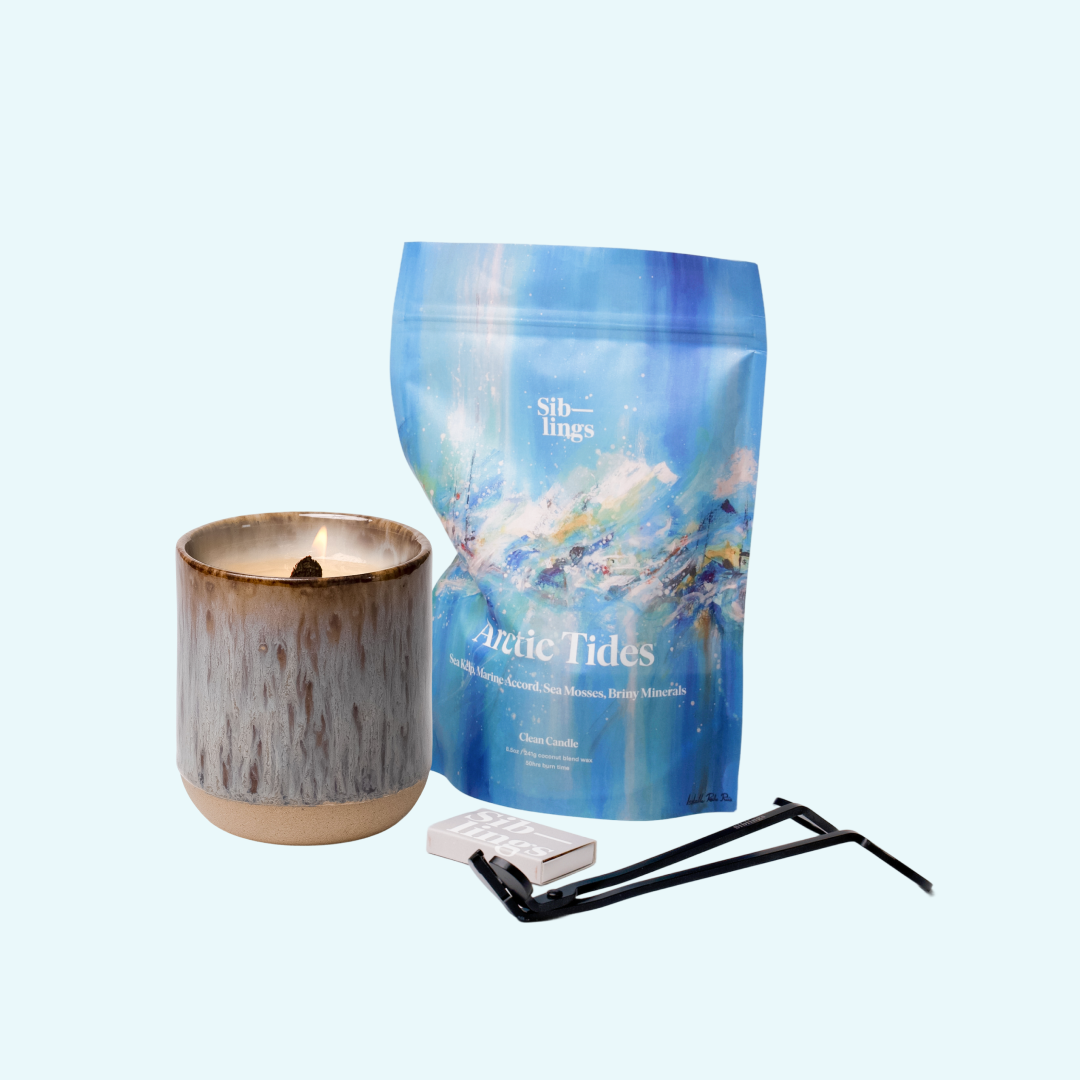 Siblings Arctic Tides candle starter set with Earth vessel, compostable wax refill bag, and black wick trimmer, showcasing an eco-friendly refill kit.