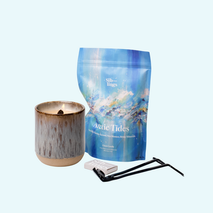 Siblings Arctic Tides candle starter set with Earth vessel, compostable wax refill bag, and black wick trimmer, showcasing an eco-friendly refill kit.