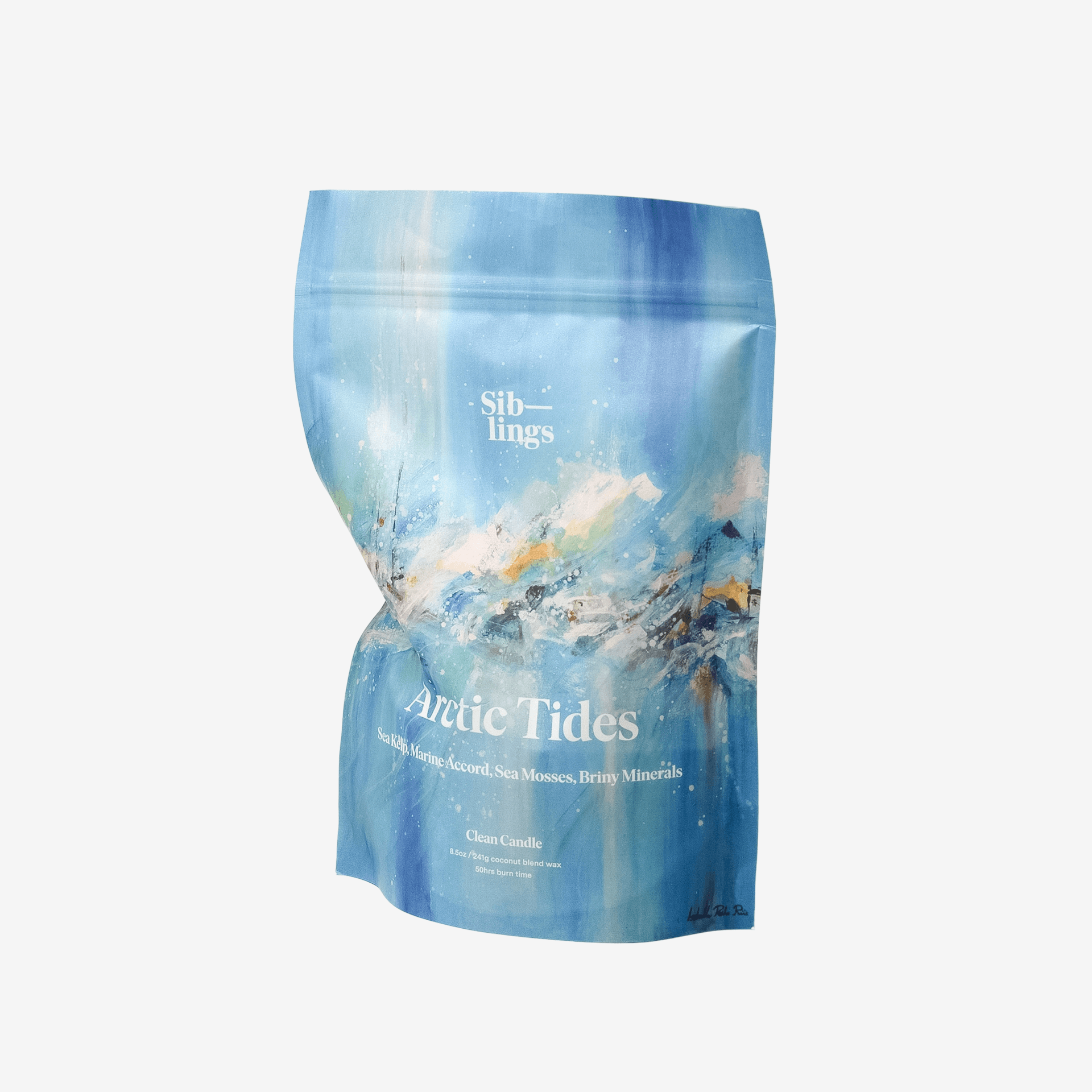 A blue Siblings candle refill bag for the "Arctic Tides" scent, which features fragrance notes of Wild Mint, White Lavender, Sea Moss, and Ocean Minerals.